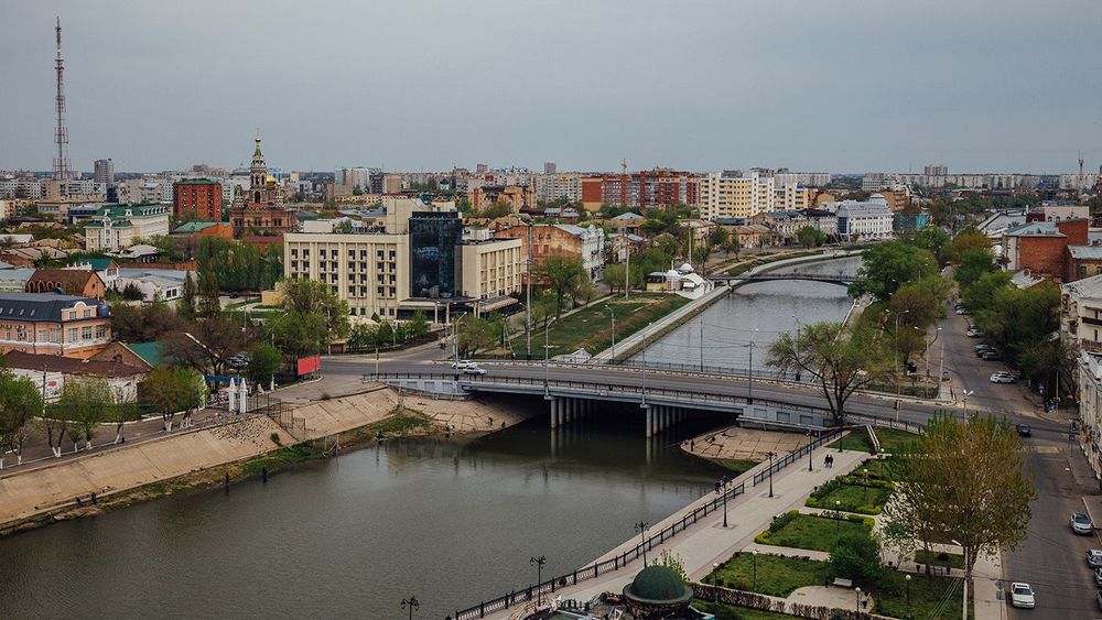 2844945 Aerial Astrakhan day cityscape from rooftop. View to bri
