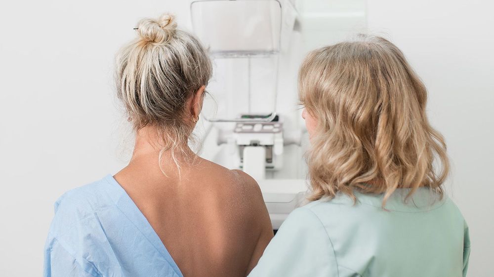 50-year-old woman undergoes mammography procedure on special med