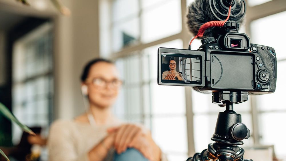Woman blogger recording her content on camera