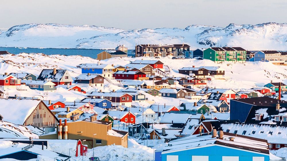 Lots of Inuit houses scattered on the hill in Nuuk city covered
