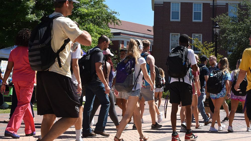 College students walking across campus