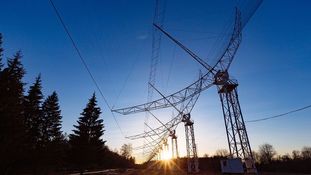 Antenna Array. A long row of radio telescopic antennas at the sunset