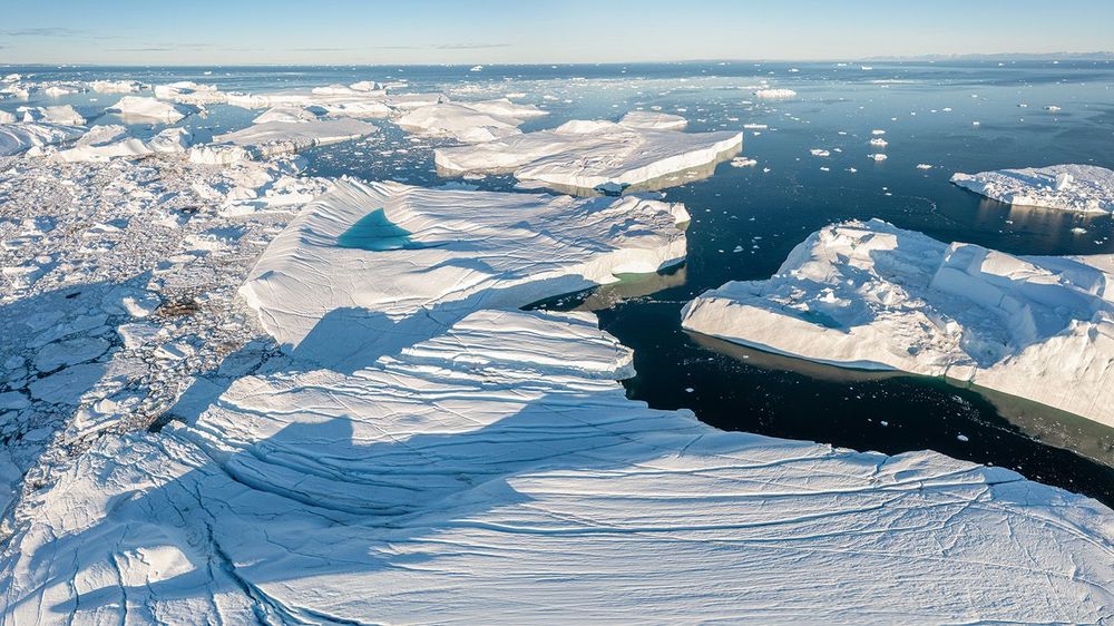Climate change and global warming. Icebergs from a melting glaci