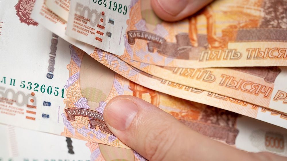 Manual counting of five thousand Russian rubles banknotes. Male hands count Russian rubles. Russian 5000 banknotes. Counting money. Cash counting. Selected focus, close-up
