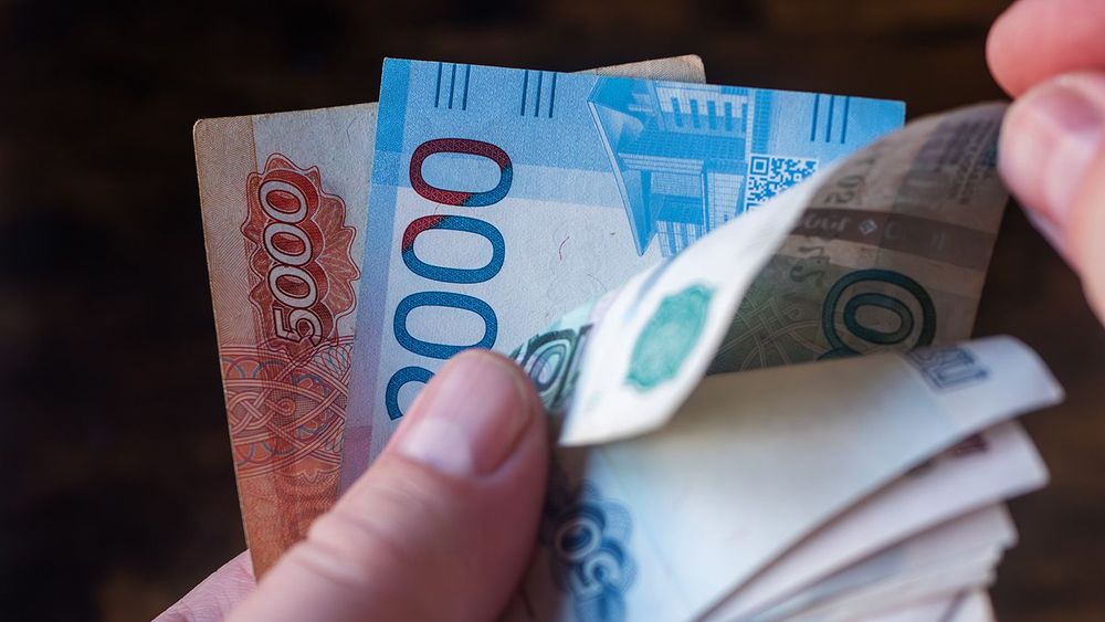 Counting a Variety of Russian Banknotes in Hand