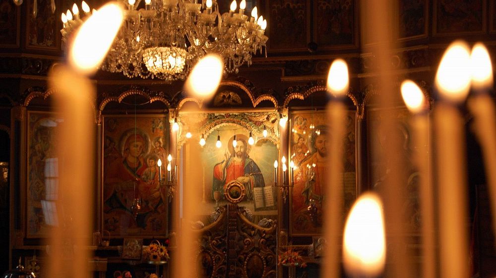 Burning candles in orthodox church