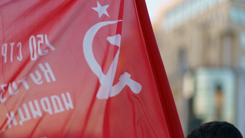 Soviet Union flag waving at the city street.