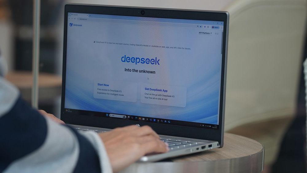 In this photo illustration, A woman browses deepseek website