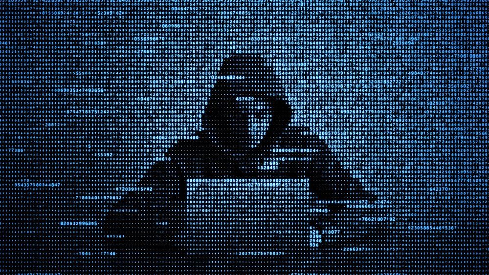 Hacker in data security concept. Hacker using laptop. Hacking the Internet. Cyber attack.