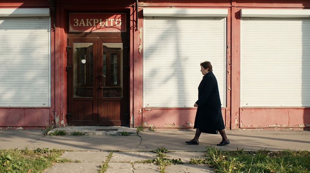 magnific_a-woman-walks-past-a-clos_DohagBCpcl copy