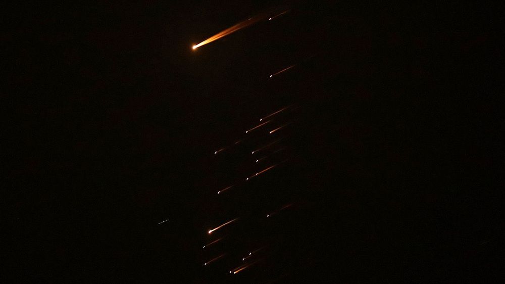 Missiles launched from Iran towards Israel seen over Hebron in West Bank