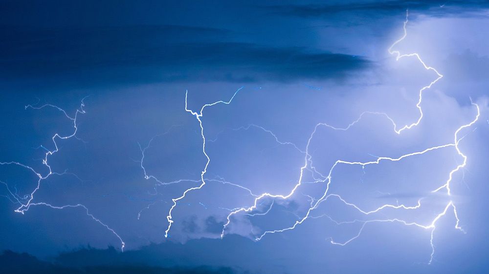 Panorama view of thunder storm lightning strike on the dark clou
