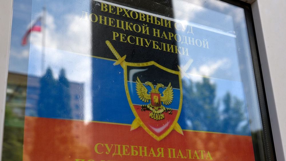 Foreign members of Ukraine's Azov Battalion, charged with mercenary activities, appear in court in Donetsk