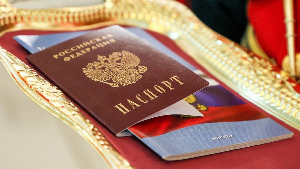 Presenting passports to schoolchildren on Russia's Constitution Day