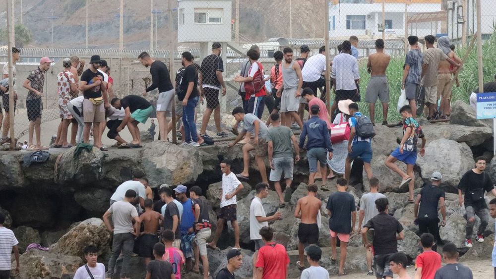 Thousands of migrants enter Spanish enclaves in North Africa