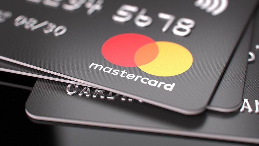 Mastercard bank cards on the table. Close-up of the Mastercard logo. E-commerce concept. Selected focus. Moscow, Russia - April 27, 2022